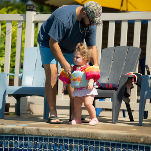 Baby and Dad poolside